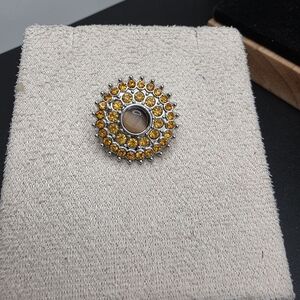 Elegant Gold and Silver Button (1883)